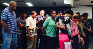 female and male in Townsville praying together
